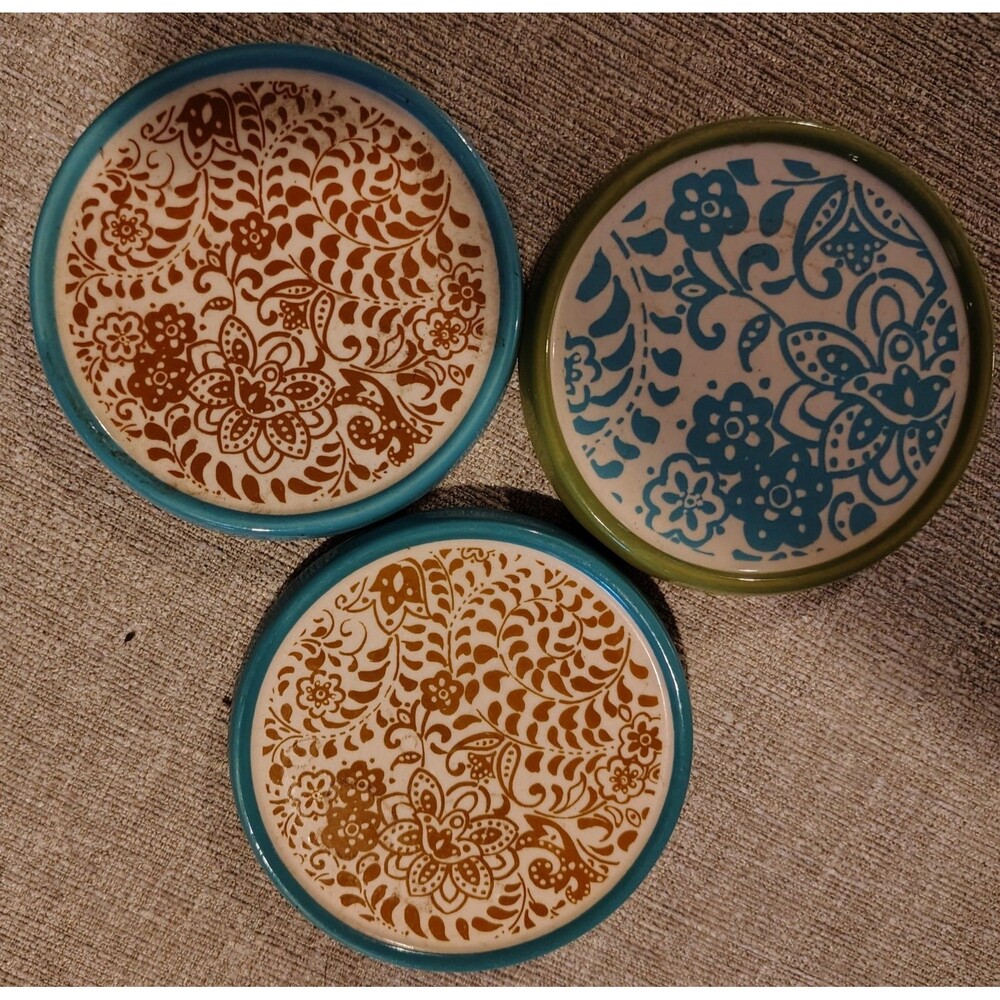 All ceramic on the front and cork on the backand decorative coasters